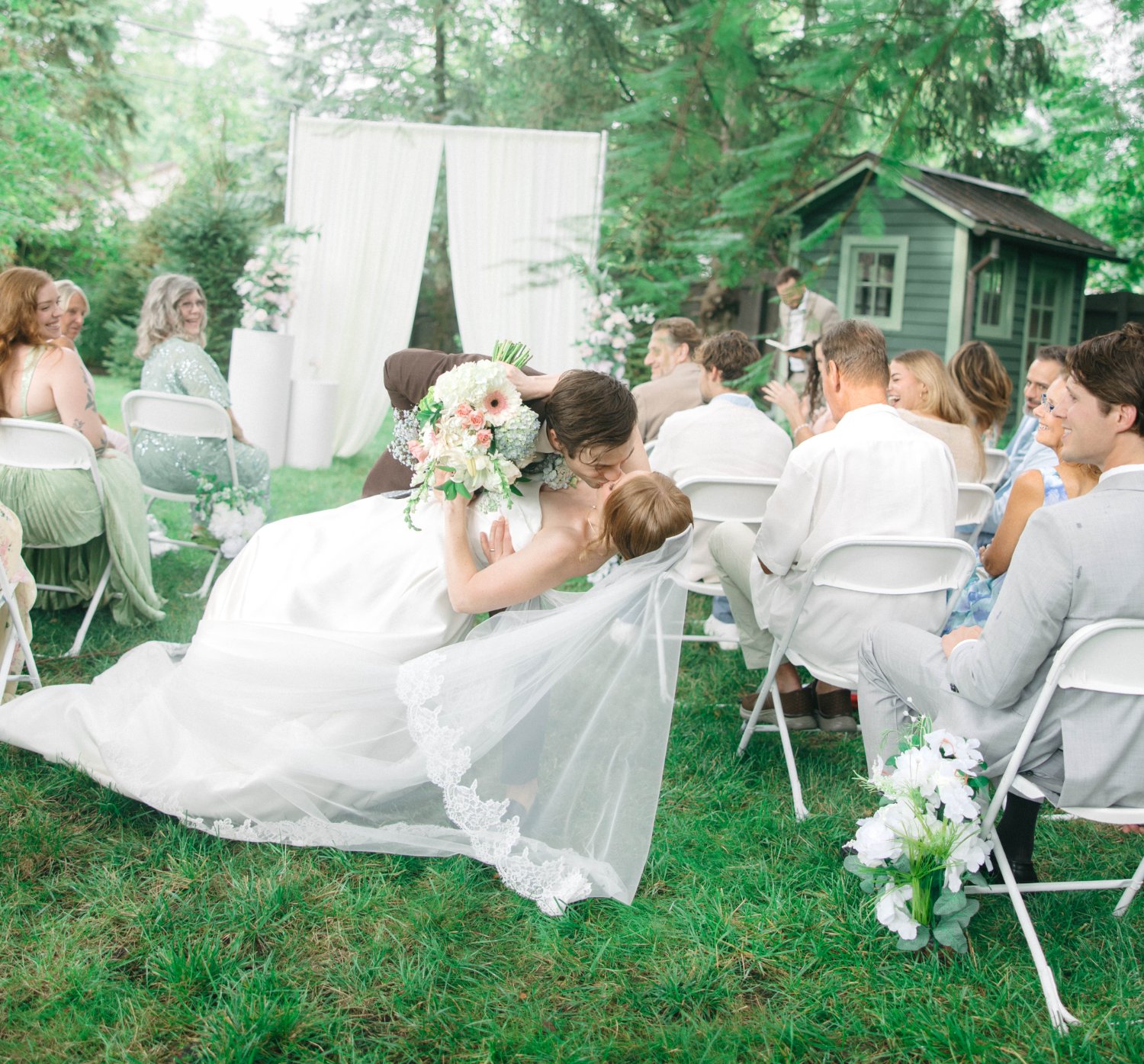 Cody dipping Katrina for a kiss halfway back down the aisle