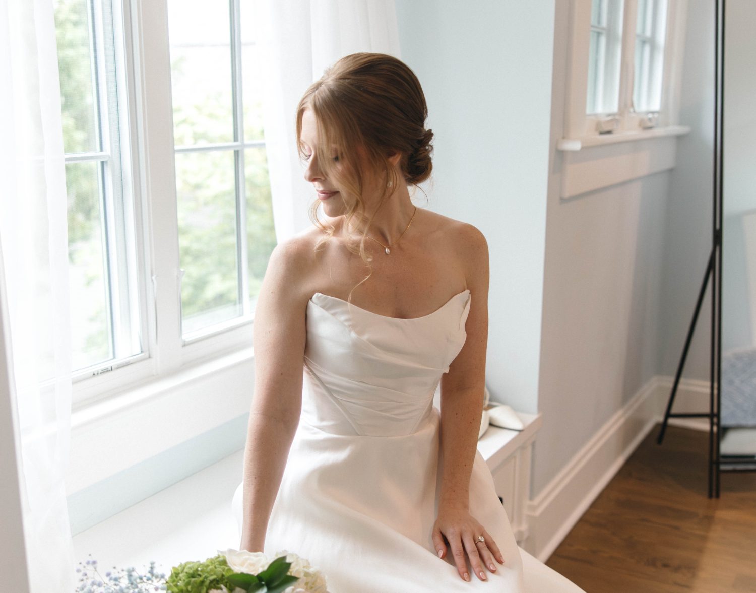 Katrina by the window in her dress