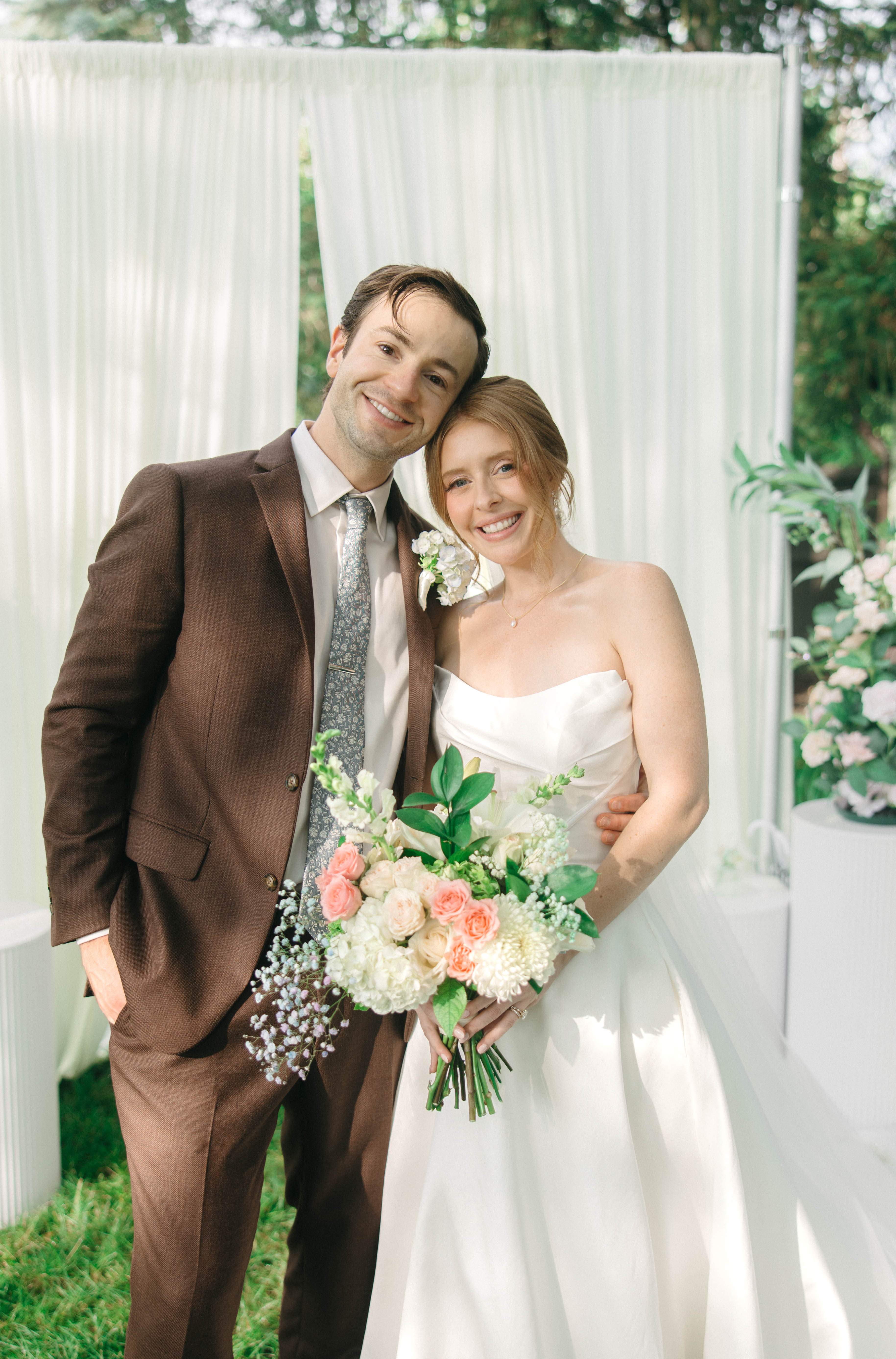 Cody and Katrina in front of the ceremony curtain