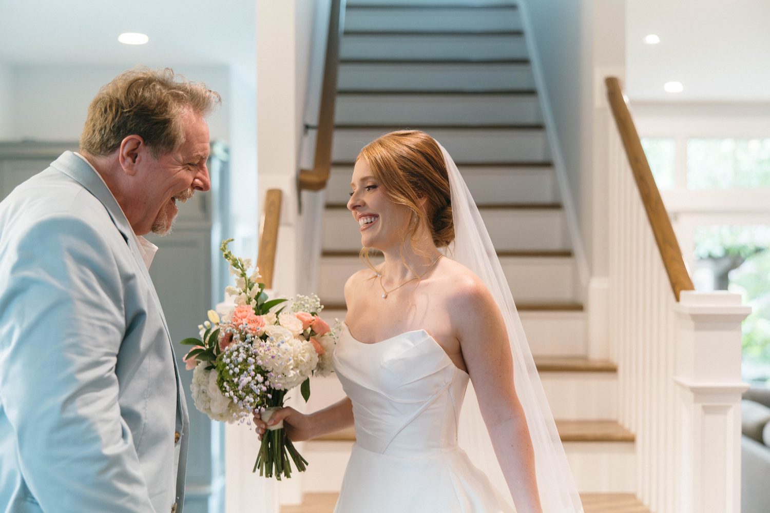 Katrina and her dad by the stairs