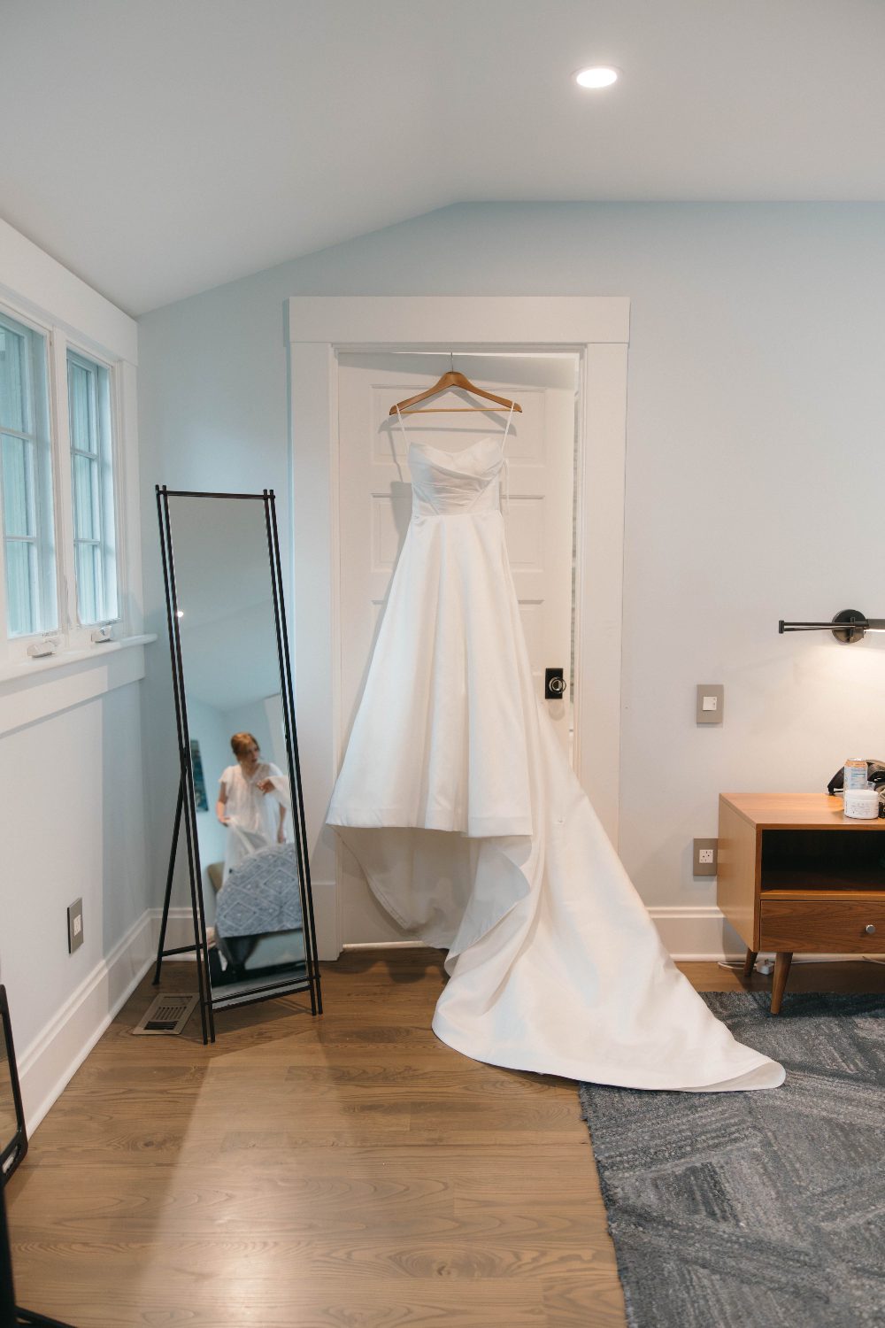 The dress hanging in the doorway