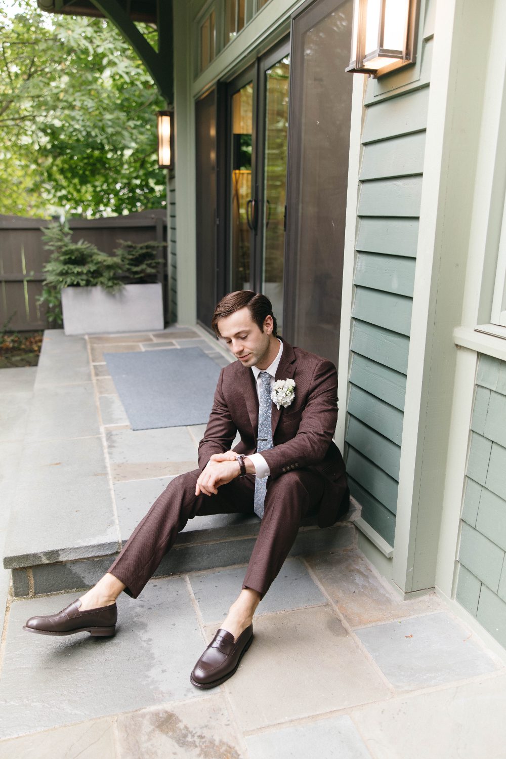 Cody seated on the porch steps