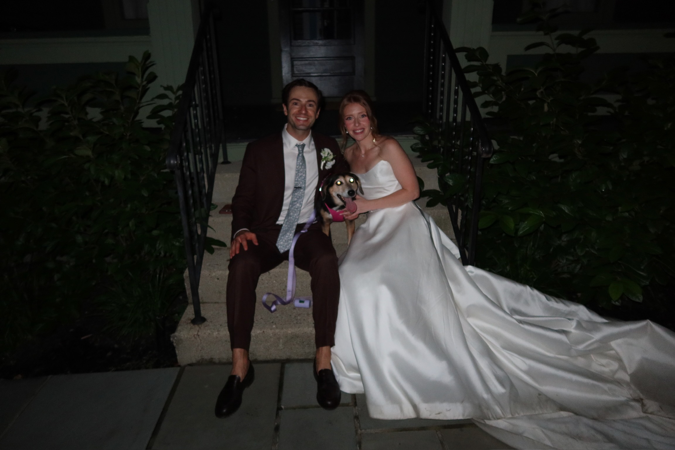 Cody and Katrina on the front steps at night with Hadley