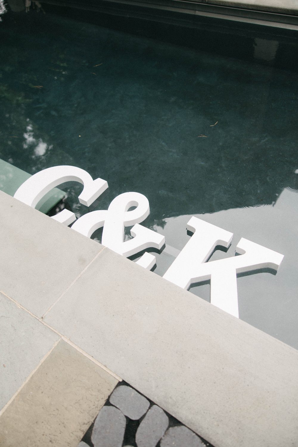 C and K letter floats in the reflecting pool