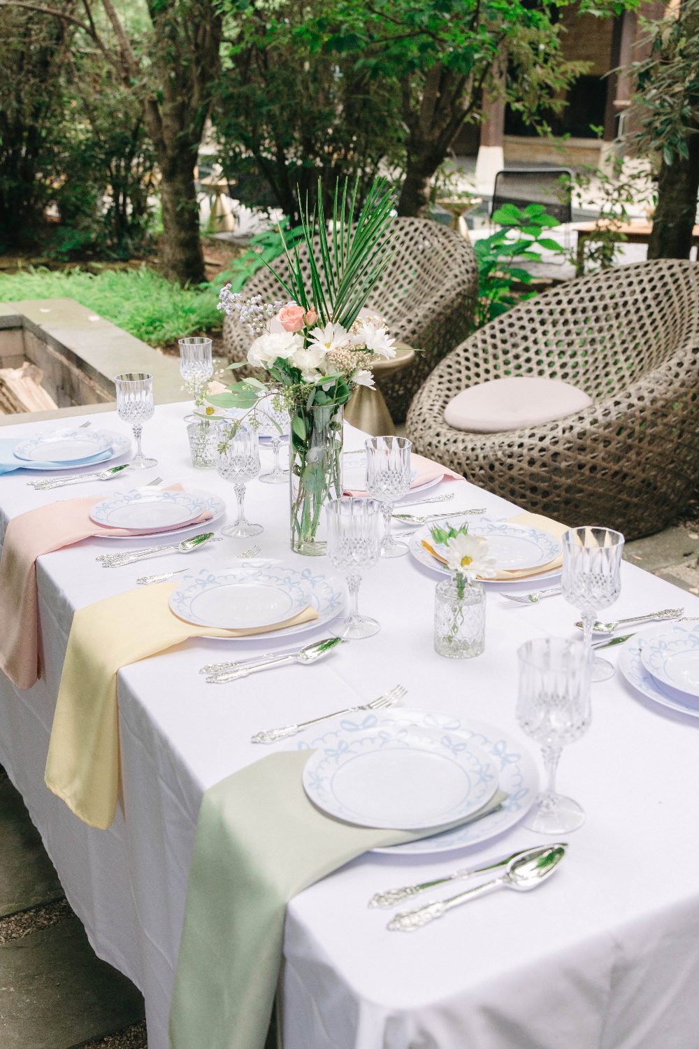 The dinner table set under the pergola