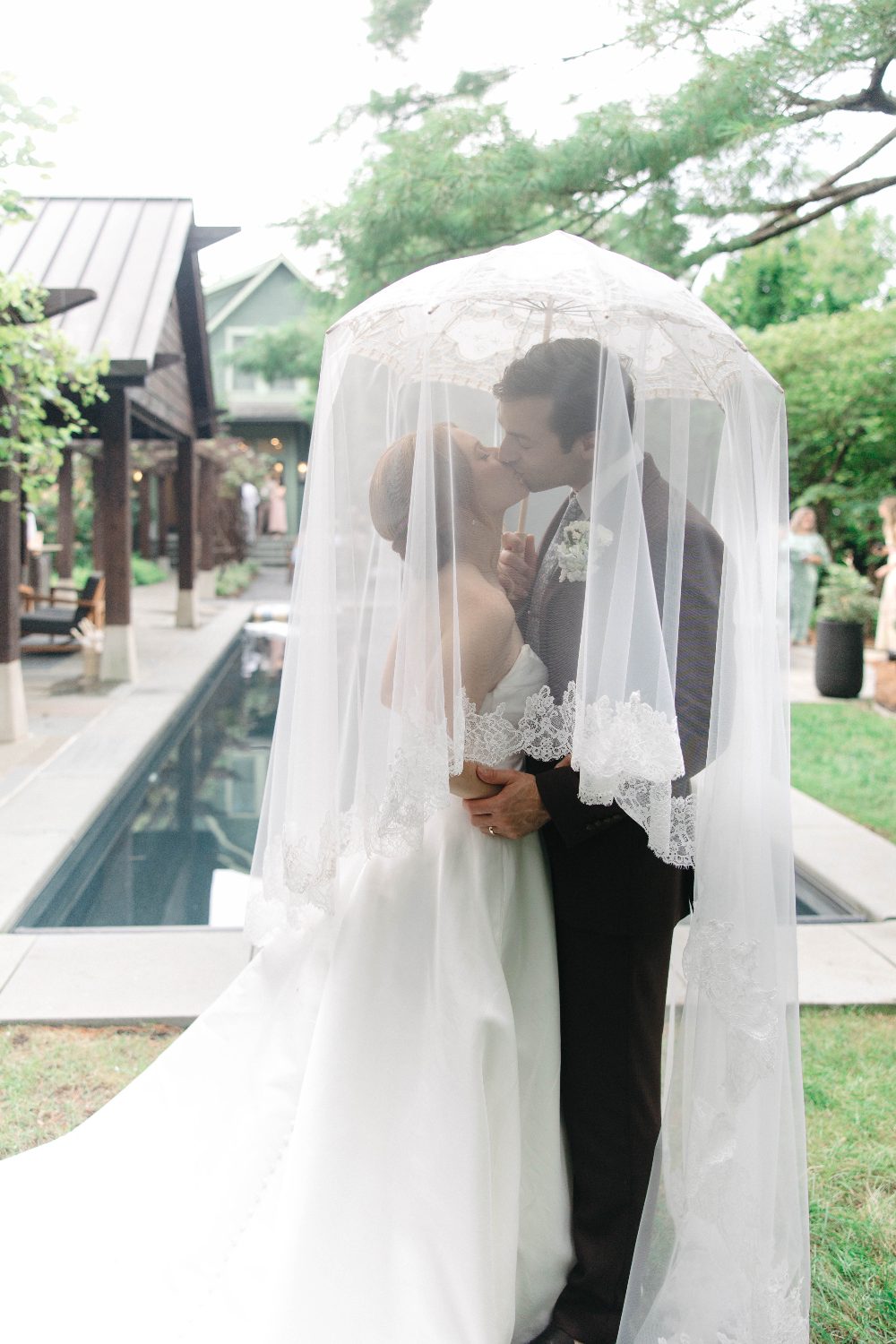 Cody and Katrina kissing under the veil