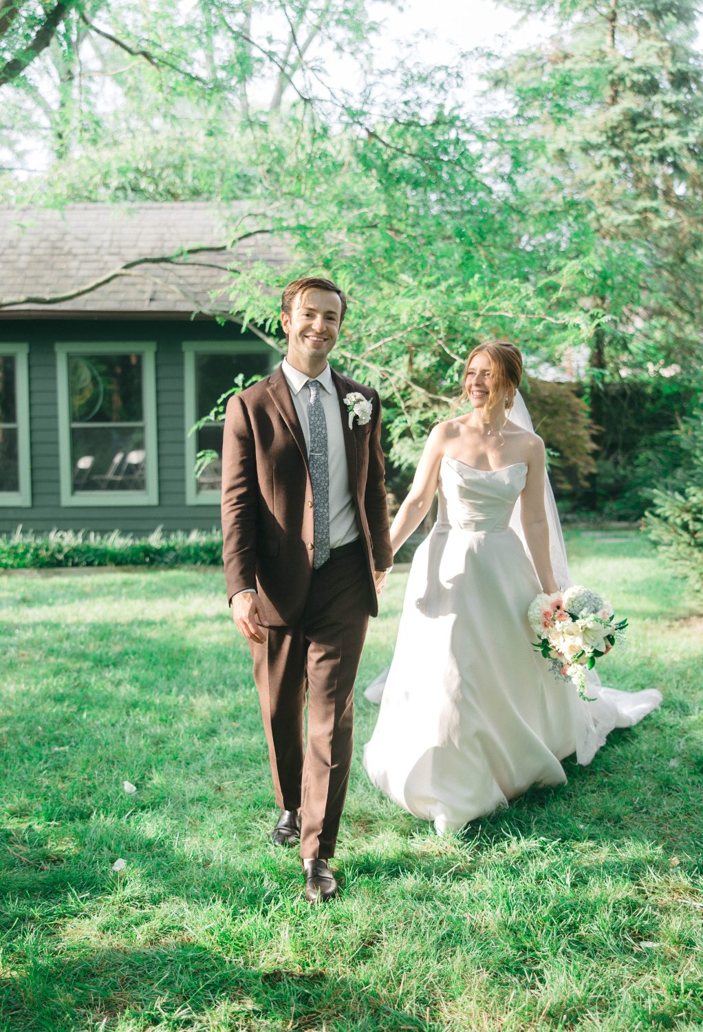 Cody and Katrina walking across the lawn